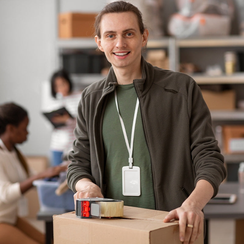 A dude using a packing tape